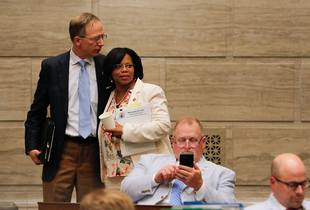 Sen. Jamilah Nasheed, D-St. Louis, hugs Sen. Bob Onder, R-Lake Saint Louis